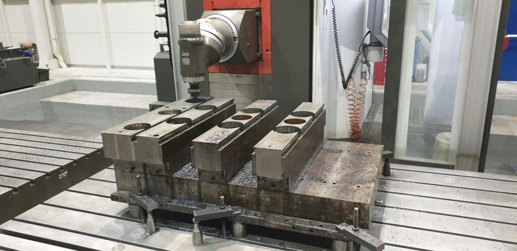 Roughing out machining of press table hydraulic cylinder bores for fitting steel sleeves